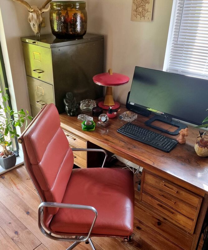 Kya's workspace: Metal filing cabinet (1940s), €35, CJM, Marina Commercial Park, Cork; Spanish Fase lamp (1960s), gift, eBay; Danish office desk in rosewood (1960s), €150 found on DoneDeal; sculpture and glass (1920s-1970s), €1-€40, boot sales; Eames chair, (1980s), €90, from defunct secondhand office supply, 2010; antlers, found on walk, Doulton jardinière (c.1900), gift. Kya's workspace: Metal filing cabinet (1940s), €35, CJM, Marina Commercial Park, Cork; Spanish Fase lamp (1960s), gift, eBay; Danish office desk in rosewood (1960s), €150 found on DoneDeal; sculpture and glass (1920s-1970s), €1-€40, boot sales; Eames chair, (1980s), €90, from defunct secondhand office supply, 2010; antlers, found on walk, Doulton jardinière (c.1900), gift.