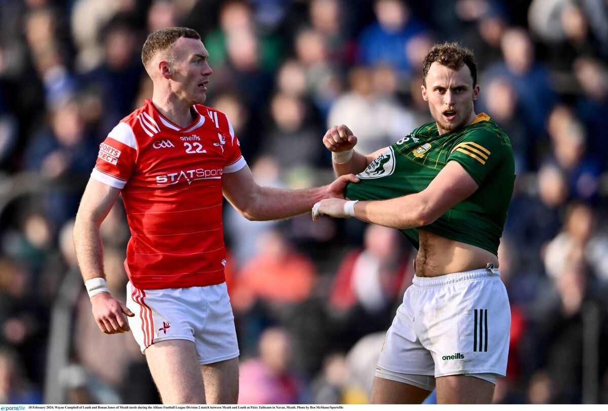 Wayne Campbell of Louth and Ronan Jones of Meath tussle during a Allianz Football League Division 2 match at Páirc Tailteann in Navan, Meath. Photo by Ben McShane/Sportsfile