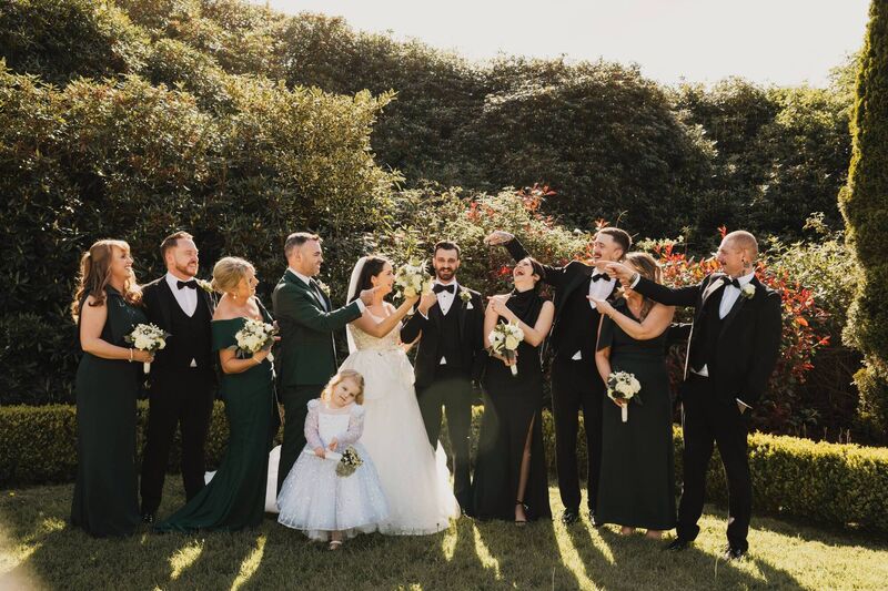 Nicola Holly and Chayse Byrnes with their wedding party. 