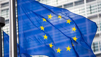 EU flag in front of Berlaymont building facade