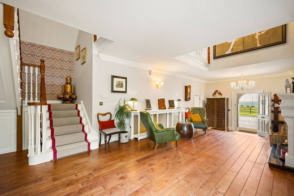 One of the two staircases, in the lofty hall in this case