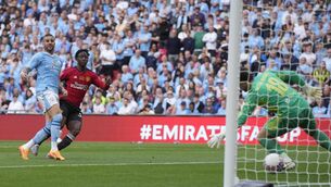 <p>WINNER: Manchester United's Kobbie Mainoo scores his side's second goal. Pic credit: AP Photo/Kin Cheung.</p>