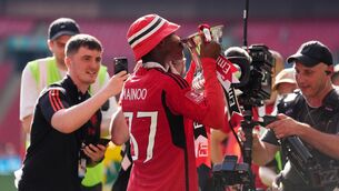 <p>RISING STAR: Manchester United's Kobbie Mainoo celebrates with the FA Cup. Photo credit: John Walton/PA Wire.</p>