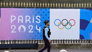 <p>READY TO ROLL: A Policeman walking past Olympic signage at the French National Assembly, Paris, ahead of the Paris Olympic Games which will start on July 26. Pic: Adam Davy/PA Wire</p>