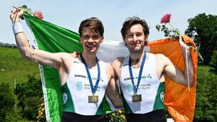 <p>Ireland’s Paul O'Donovan and Fintan McCarthy celebrate winning a bronze medal in the lightweight men's double sculls at World Cup II in Lucerne. Picture: ©INPHO/Detlev Seyb</p>