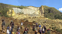 Papua New Guinea’s government says landslide buried 2,000 people