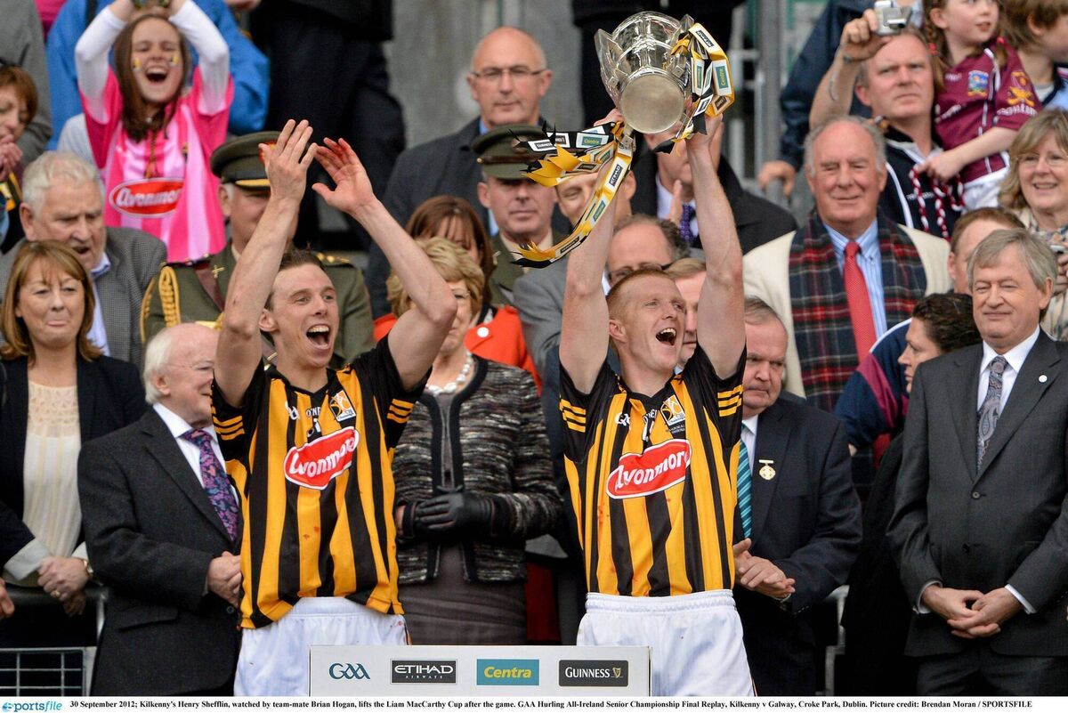 Kilkenny's Henry Shefflin, watched by team-mate Brian Hogan, lifts the Liam MacCarthy Cup after the 2012 All-Ireland hurling final against Galway. Picture: Brendan Moran / SPORTSFILE