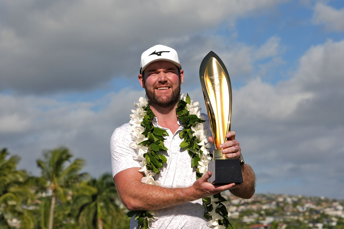 Grayson Murray holds the trophy after winning the 2024 Sony Open at Waialae Country Club in Honolulu. Picture: AP Photo/Matt York