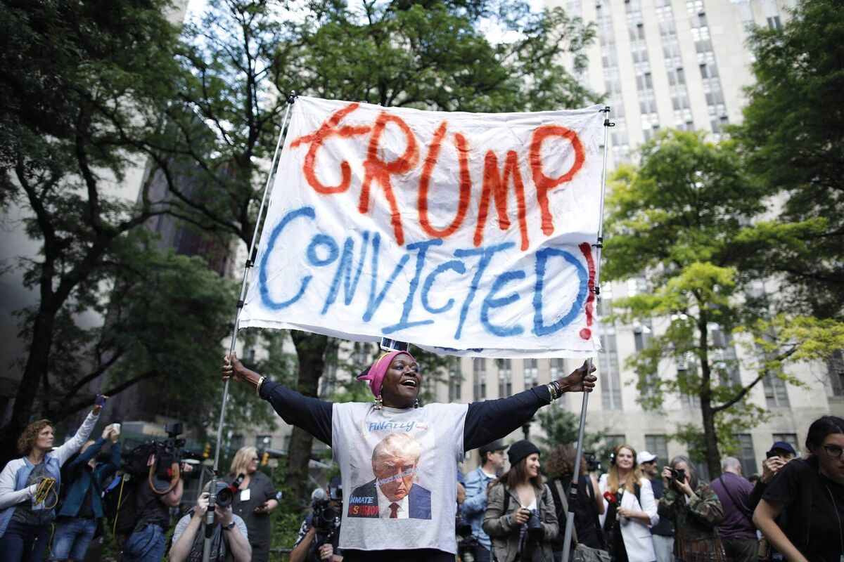 People react after former US President and Republican presidential candidate Donald Trump was convicted in his criminal trial outside of Manhattan Criminal Court in New York City, on May 30, 2024. Picture: KENA BETANCUR/AFP via Getty Images