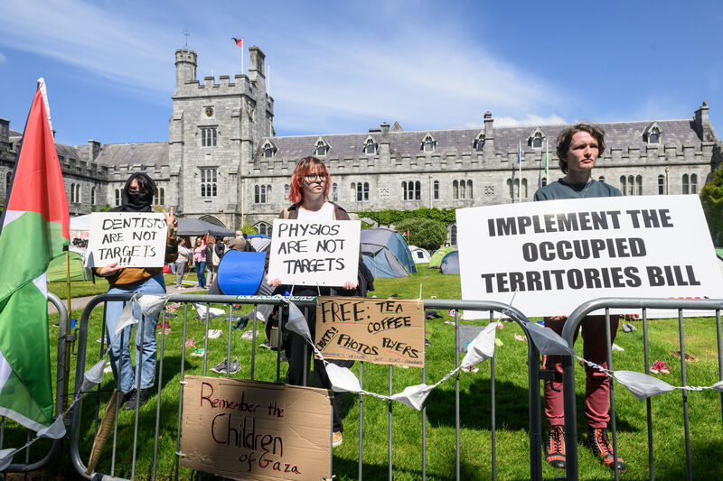 Members of the Boycott, Divest and Sanctions (BDS) campaign group chanted slogans as graduates and their families left the ceremony on Friday morning, before returning to their encampment on UCC's Main Quad. Picture Dan Linehan Members of the Boycott, Divest and Sanctions (BDS) campaign group chanted slogans as graduates and their families left the ceremony on Friday morning, before returning to their encampment on UCC's Main Quad. Picture Dan Linehan