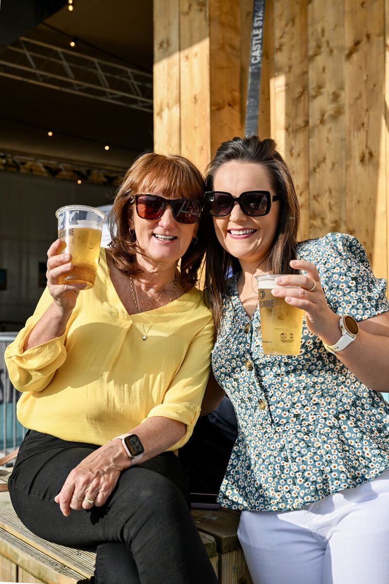 When That Evening Sun Goes Down: Yvonne and Fiona O’Donovan from Cobh enjoying drinks in the beautiful sunshine at the Marquee before Van Morrison's concert. Picture: Chani Anderson When That Evening Sun Goes Down: Yvonne and Fiona O’Donovan from Cobh enjoying drinks in the beautiful sunshine at the Marquee before Van Morrison's concert. Picture: Chani Anderson