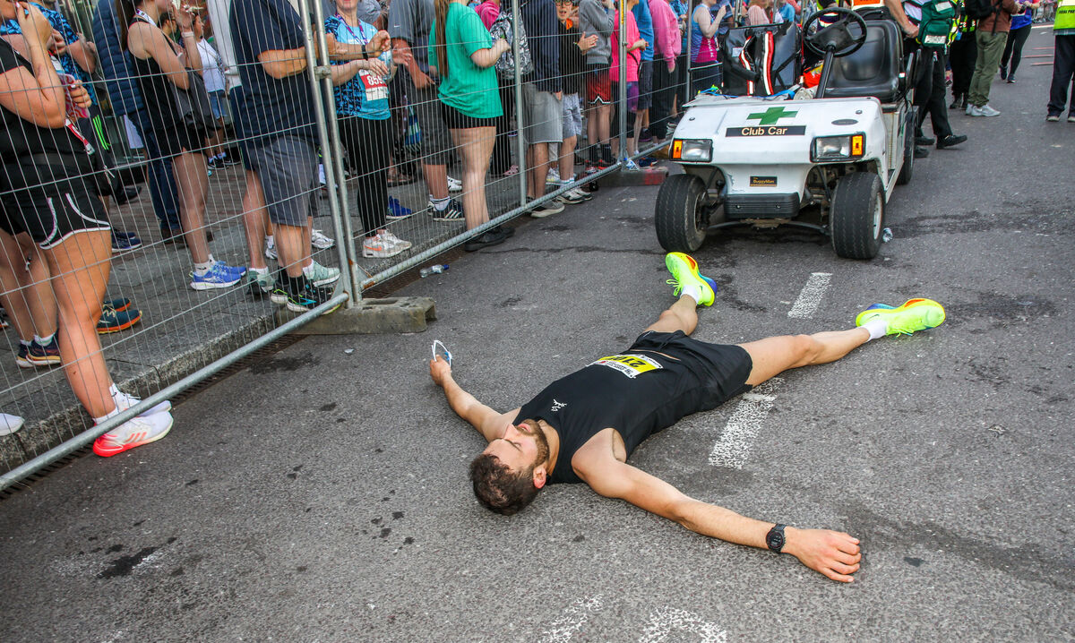 Runner Chris Jeuken lies exhaused after finishing the Cork City Marathon in fourth place. Picture: David Creedon