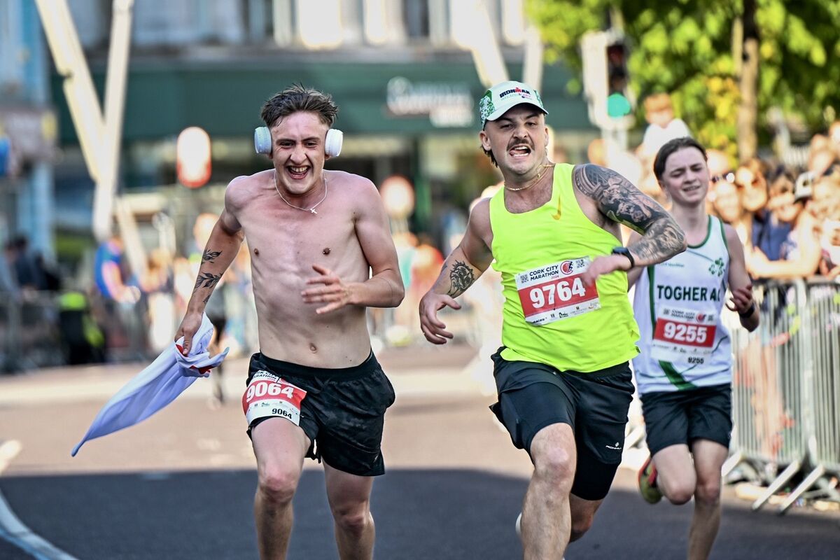 Friends, Jack Austin and David O’Regan race to the finishing line in the 10km competition during the 2024 Cork City Marathon. Picture Chani Anderson