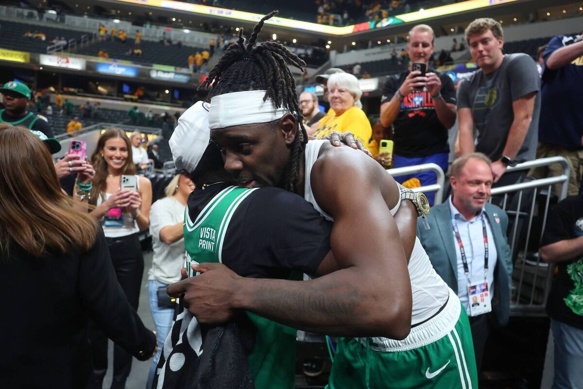  Jrue Holiday #4 of the Boston Celtics hugs Flava Flav after defeating the Indiana Pacers. Photo by Stacy Revere/Getty Images.