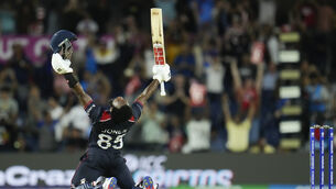 <p>DRAMATIC WIN: Aaron Jones was the hero, hitting an unbeaten 36 in the chase, before striking 11 in the one-over decider to set a target of 19. Pic: AP Photo/Julio Cortez</p>