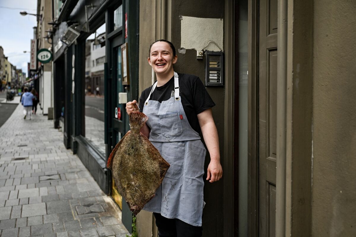 Aishling Moore hooks a turbot outside her Michelin Bib restaurant, Goldie. Picture: Chani Anderson