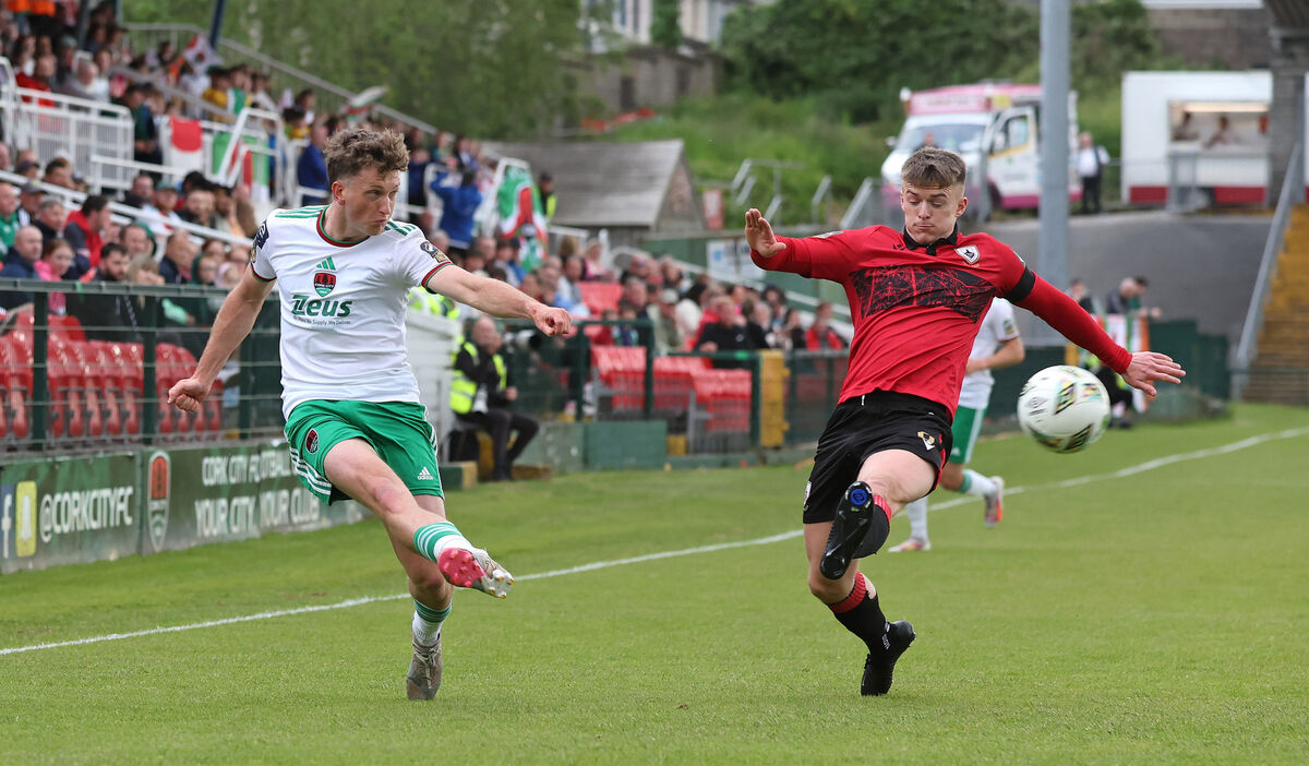  Cian Bargary, Cork City, battles with Kyle O'Connor, Longford Town.