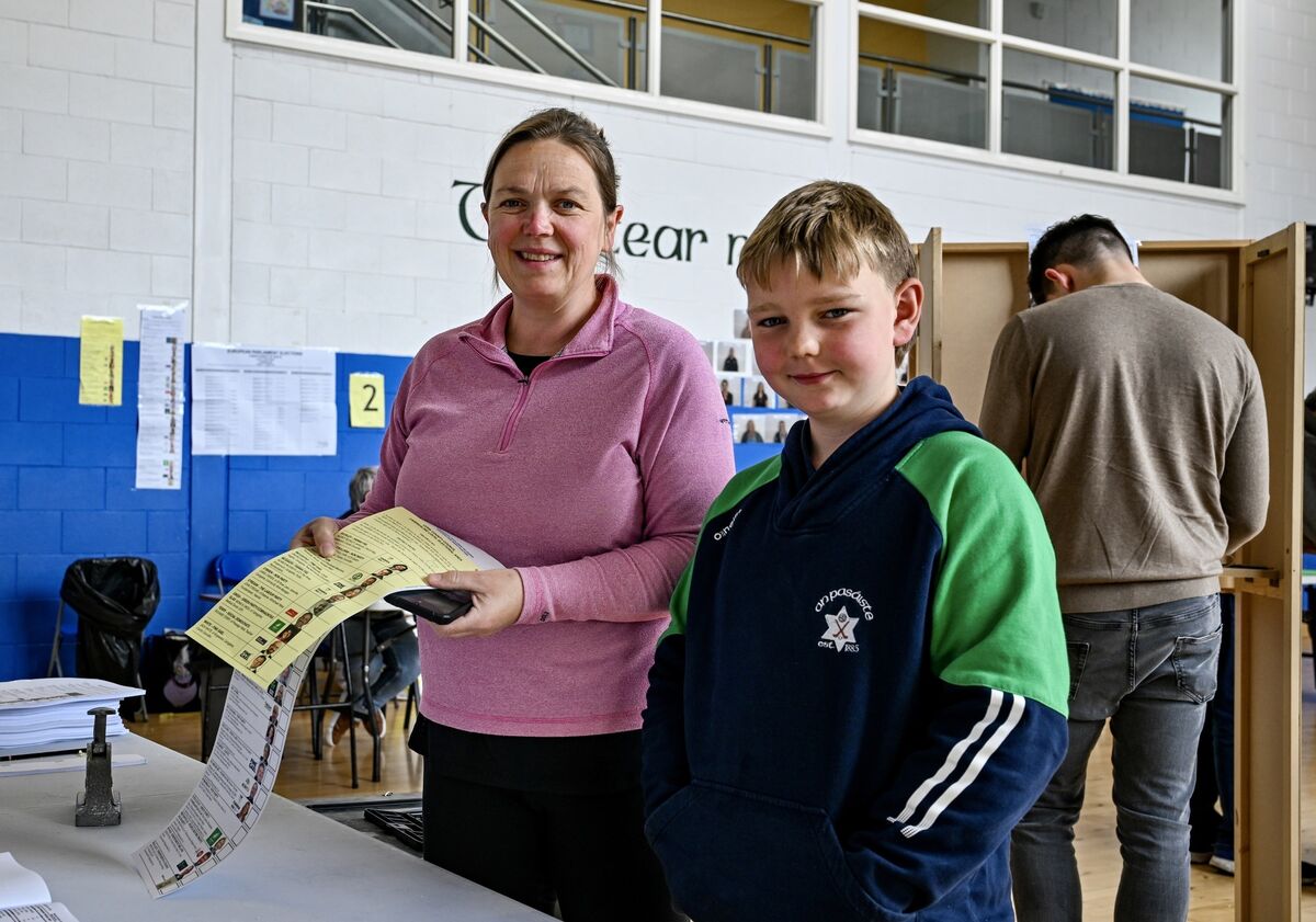 Grace Leonard casts her vote in Friday’s elections while her son Darragh Kenny (9) offers moral support. Picture: Chani Anderson
