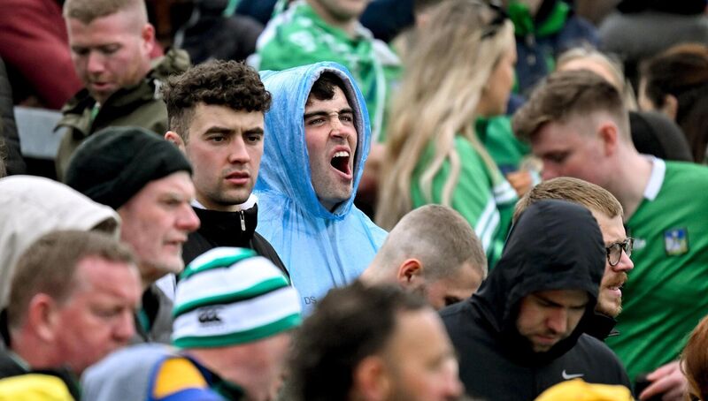 A supporter yawns as he awaits power to be restored to the stadium. Pic: Brendan Moran/Sportsfile