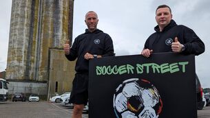 <p>DOWN OUR STREET: Derek Coughlan and Denis Behan at Soccer Street in Marina Market</p>