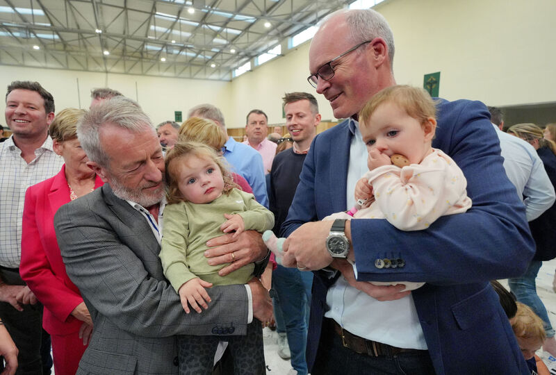 Newly re-elected MEP Seán Kelly holding his two-year-old granddaughter Eloise Kelly, while Fine Gael director of elections Simon Coveney holds Mr Kelly's one-year-old granddaughter Hannah-Rose Kelly at the Ireland South count centre. Picture: Jonathan Brady/PA Newly re-elected MEP Seán Kelly holding his two-year-old granddaughter Eloise Kelly, while Fine Gael director of elections Simon Coveney holds Mr Kelly's one-year-old granddaughter Hannah-Rose Kelly at the Ireland South count centre. Picture: Jonathan Brady/PA