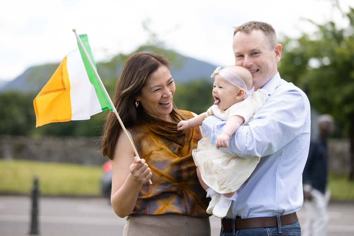 Levin Kelleher, Kildare with husband Edmond and baby Leona after receiving her citizenship.
