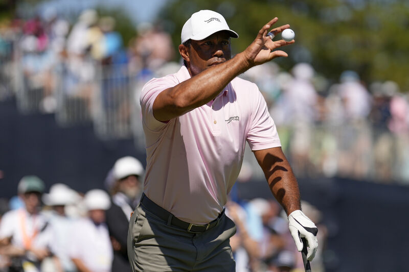 Tiger Woods catches a ball on the ninth hole during a practice round for the U.S. Open golf tournament on Tuesday. AP Photo/George Walker IV. Tiger Woods catches a ball on the ninth hole during a practice round for the U.S. Open golf tournament on Tuesday. AP Photo/George Walker IV.