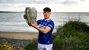 <p>GAME HE LOVES: David Dooley of Laois poses for a portrait with the Liam MacCarthy cup. Photo by Brendan Moran/Sportsfile</p>