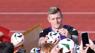 <p>THE LAST DANCE: Toni Kroos of Germany signs autographs after a training session. </p>