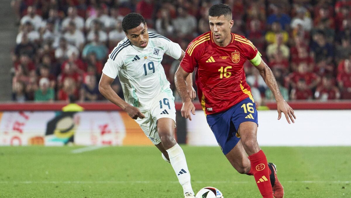 KEY MAN: Northern Ireland's Shea Charles chases Spain skipper Rodri. Pic: Rafa Babot/Getty Images KEY MAN: Northern Ireland's Shea Charles chases Spain skipper Rodri. Pic: Rafa Babot/Getty Images