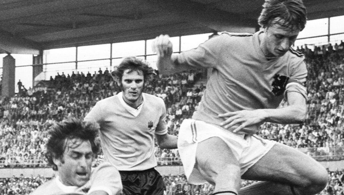 Cruyff jumps to avoid Uruguayan defender Ricardo Pavoni in Hannover. The Dutch won 2-0. Cruyff jumps to avoid Uruguayan defender Ricardo Pavoni in Hannover. The Dutch won 2-0.