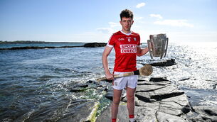 <p>SEA CHANGE: Cork's Ethan Twomey poses for a portrait with the Liam MacCarthy Cup at Spanish Point in Clare. Pic: Brendan Moran/Sportsfile</p>