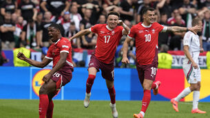 <p>GOALSCORER: Switzerland's Kwadwo Duah, left, celebrates after scoring his side's opening goal besides teammates Ruben Vargas, center, and Granit Xhaka. Pic: Darko Vojinovic, AP</p>