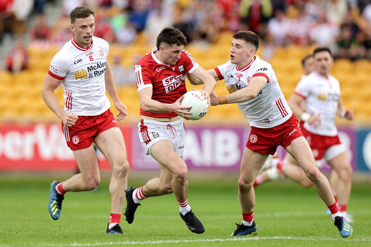 Cork's Chris Óg Jones with Tyrone's Niall Devlin and Brian Kennedy, Pic: Laszlo Geczo, Inpho