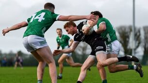 <p>BREAKING FREE: Sean Carrabine of Sligo is tackled by Emmet Rigter of Limerick. Pic: Tom Beary, Sportsfile</p>
