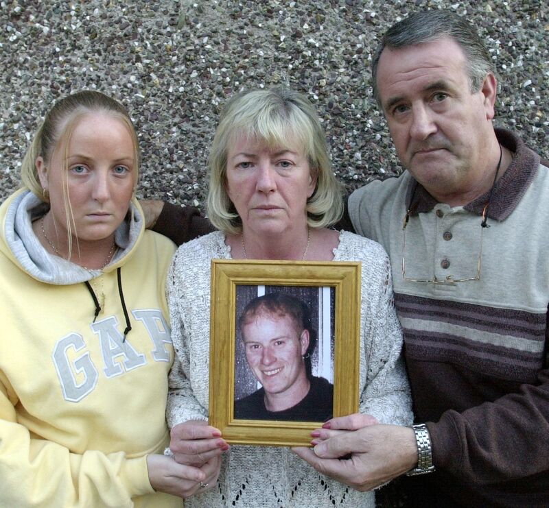 Andrew Moynihan and Lily Moynihan holding a picture of their son Adrian Moynihan who died near Sidetrax nightclub. With them is their daughter Audrey. Picture: Denis Minihane