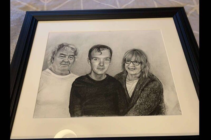 A pencil sketch of Shane Tuohey with his family.