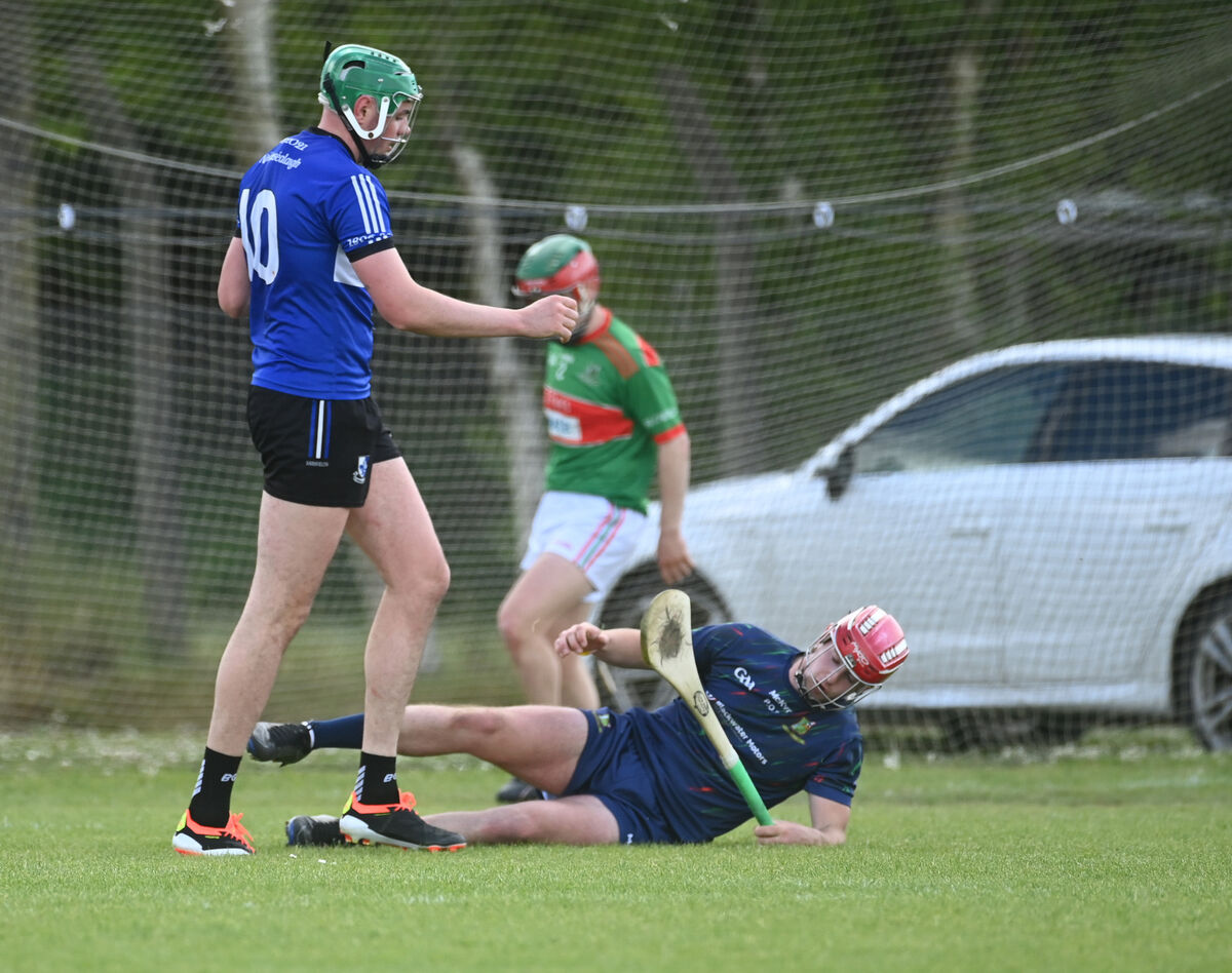 Sarsfields' James Sweeney celebrates his goal past Fr. O'Neill's goalkeeper Paudie O'Sullivan during the RedFM SHL Division 1 at Ahavine. Picture: Eddie O'Hare