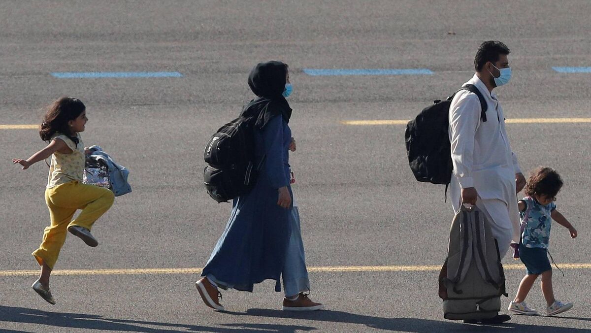 A family evacuated from Afghanistan after it fell to the Taliban arriving at Melsbroek military airport in Belgium on August 25, 2021. Picture: Johanna Geron TPX/Reuters A family evacuated from Afghanistan after it fell to the Taliban arriving at Melsbroek military airport in Belgium on August 25, 2021. Picture: Johanna Geron TPX/Reuters