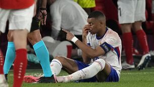 <p>Kylian Mbappe of France holds his nose after suffering an injury during a Euro 2024 Group D match against Austria. Picture: AP Photo/Frank Augstein</p>