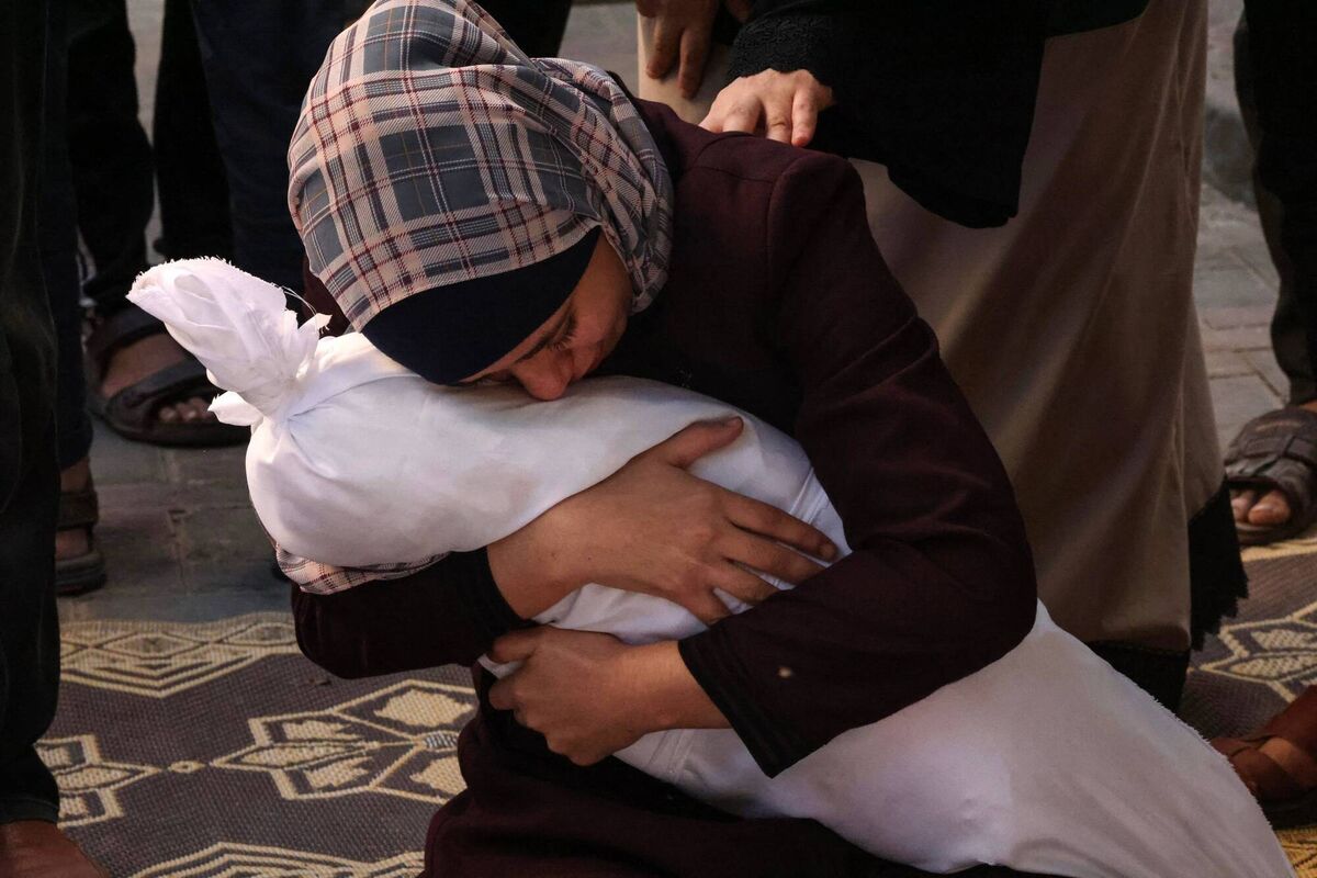 'She was the only one that remained whole, and not torn into pieces like the rest of the family'. Samia al-Atrash holding her niece Massah's remains after she and her family were killed by the Israeli bombardment in Rafah, Gaza, on October 21, 2023. Picture: Said Khatib/AFP/Getty