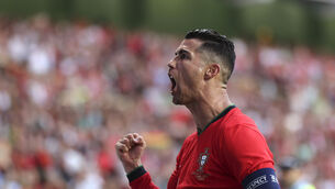 <p>STILL HERE: Portugal's Cristiano Ronaldo celebrates after scoring against Ireland. Pic: Luis Vieira, AP</p>