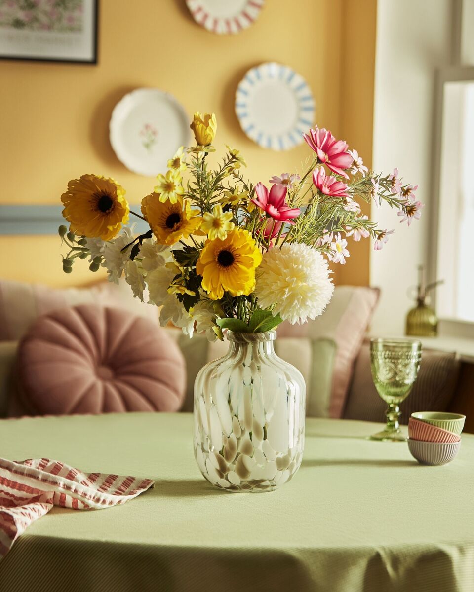  Faux flowers provide a summery accessory all year round. This selection in a glass vase is from Penneys, €8.