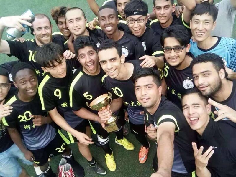 Dr Paul O'Brien holding the cup as part of the winning team in the Inter-Faculty Football Cup in Zhenjiang University, China. 