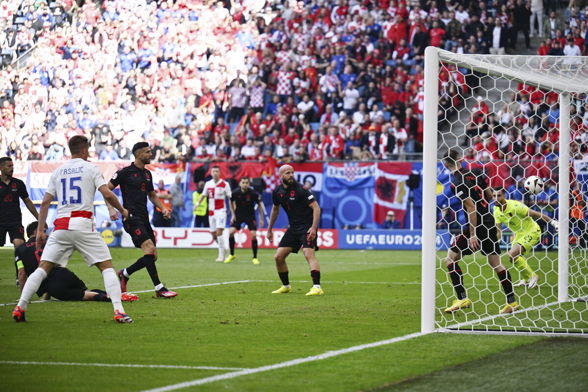 Albania's Klaus Gjasula scores an own goal. Pic credit: Sina Schuldt/dpa via AP.