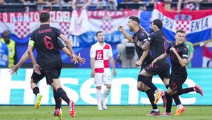 <p>DESMOND: Albania players celebrate after teammate Albania's Klaus Gjasula makes it 2-2. AP Photo/Ebrahim Noroozi.</p>