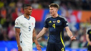 <p>Scotland's Scott McTominay (right) reacts after being shown a yellow card by match referee Ivan Kruzliak. Picture: Andrew Milligan/PA Wire.</p>