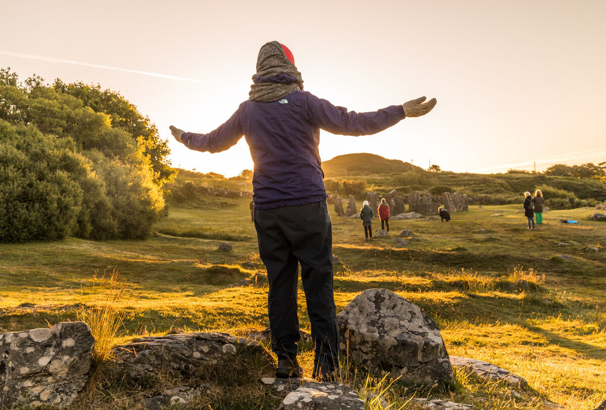 Yvonne Van Ieperenburg from the Netherlands welcomes the Summer Solstice at Drombeg Stone Circle outside Glandore, County Cork.  Picture: David Creedon
