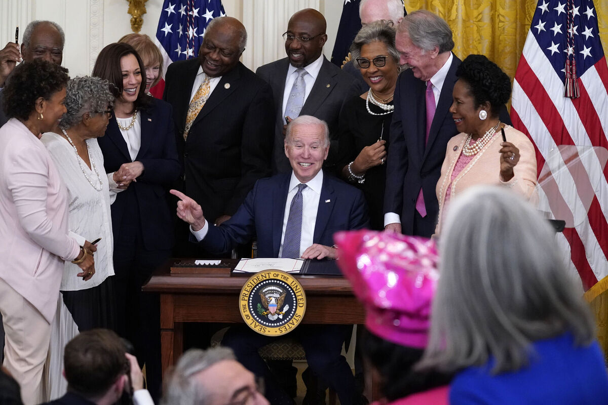 President Joe Biden points to Opal Lee after signing the Juneteenth National Independence Day Act in the East Room of the White House on June 17, 2021.