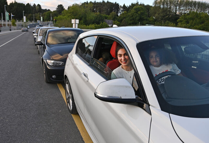 Joanna Humphreys with her niece Willow Fogarty-Bahl, seven cars back in the queue since Thursday afternoon for the viewing of the new housing estate Bayly in Douglas which opens on Saturday.